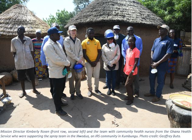 Ghana Mission Director with community health workers from the Ghana Health service outside in the community of Nwodua.